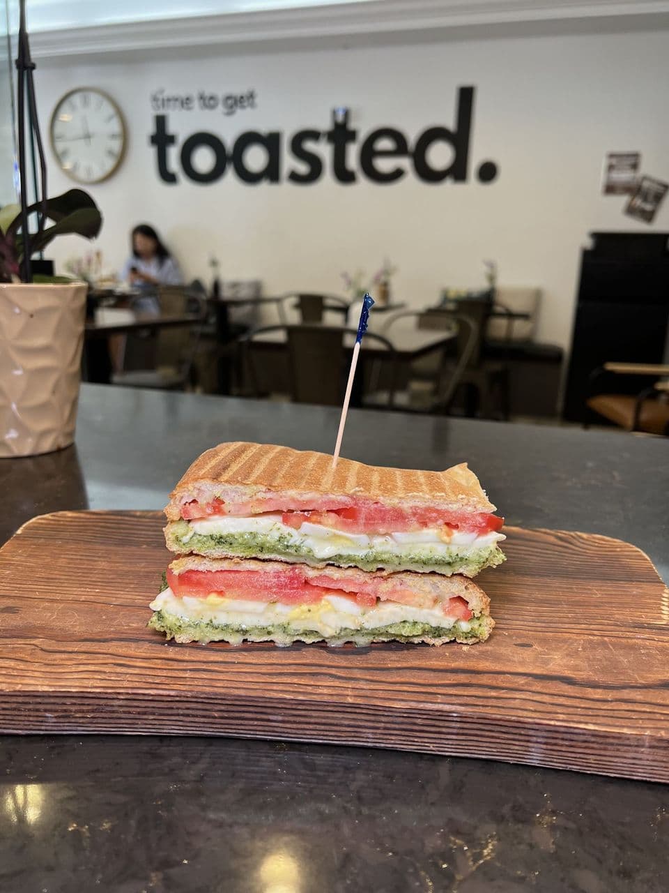 Breakfast Caprese at Toasted Cafe in Montrose — Pesto, tomato and mozzarella with a hard-boiled egg, warm off the panini grill.