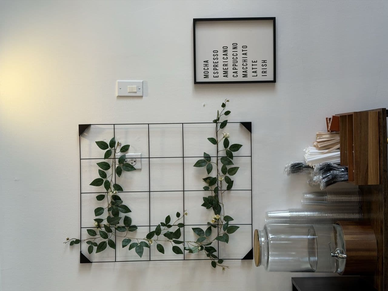 Stumptown coffee bean display wall at Toasted Cafe in Montrose