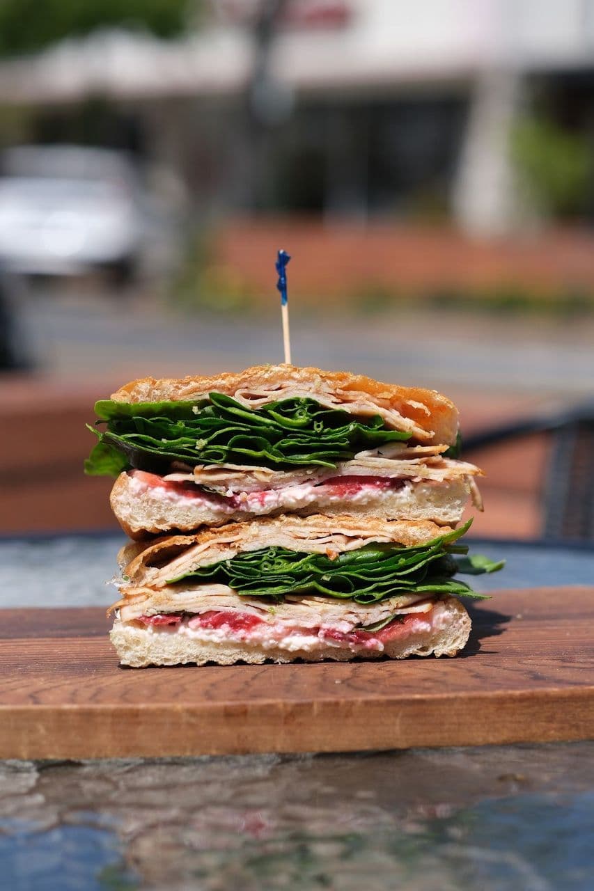 Strawberry Turkey at Toasted Cafe in Montrose — Strawberry and turkey together, with feta, basil, spinach, mayo and sweet pepper jelly.