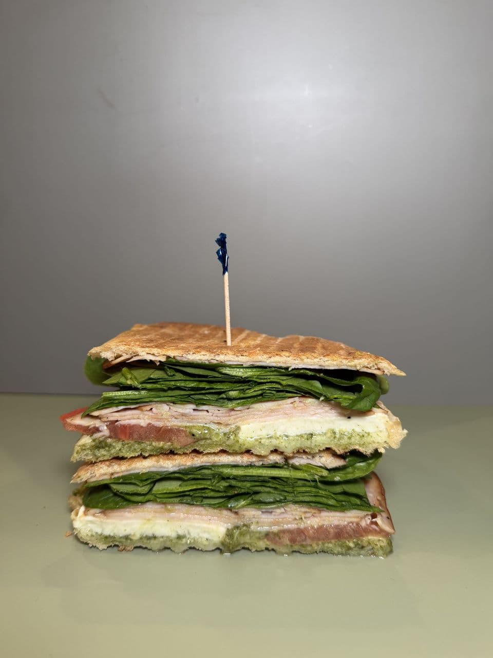 Turkey Pesto at Toasted Cafe in Montrose — Turkey and mozzarella with pesto, tomato and spinach.
