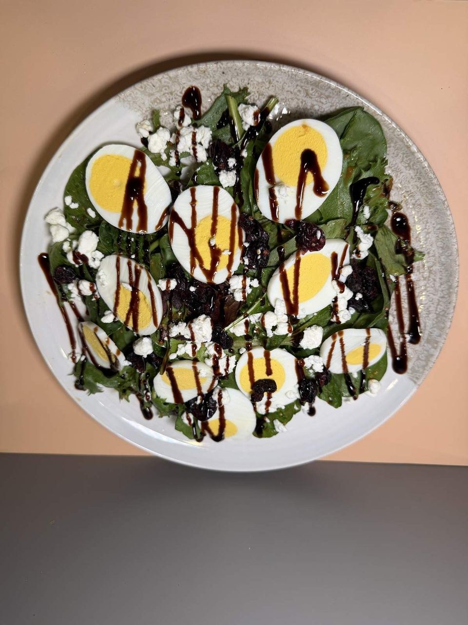 Goat Cheese Salad at Toasted Cafe in Montrose — Fresh spring mix, goat cheese, egg, cranberry, sweet dressing.